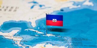 Haitian flag pin on map in the Caribbean.