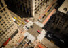 Aerial view of busy city intersection with crosswalks.