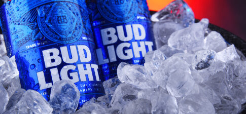 Two Bud Light cans in ice.