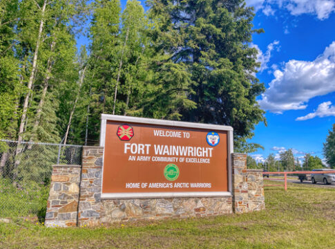 Sign for Fort Wainwright, an Army community, outdoors.