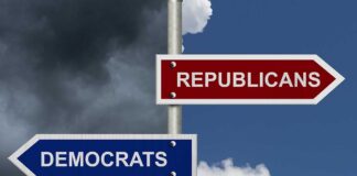 Street signs pointing to Democrats and Republicans direction.