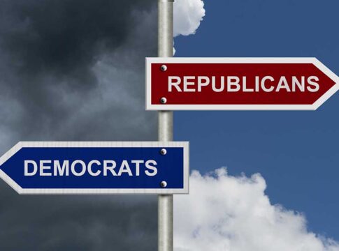 Street signs pointing to Democrats and Republicans direction.