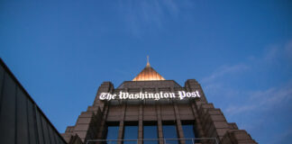 The Washington Post building against a twilight sky.