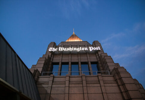 The Washington Post building against a twilight sky.