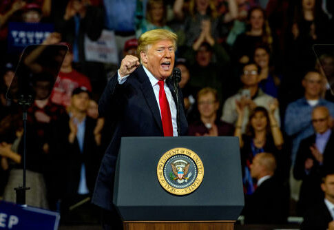 speaker at podium addressing a crowd