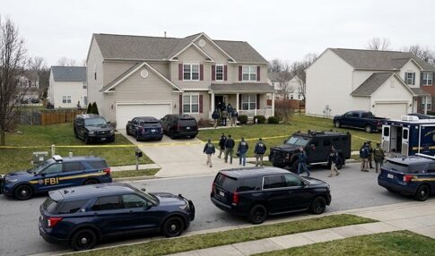 FBI agents conducting an operation in a suburban neighborhood
